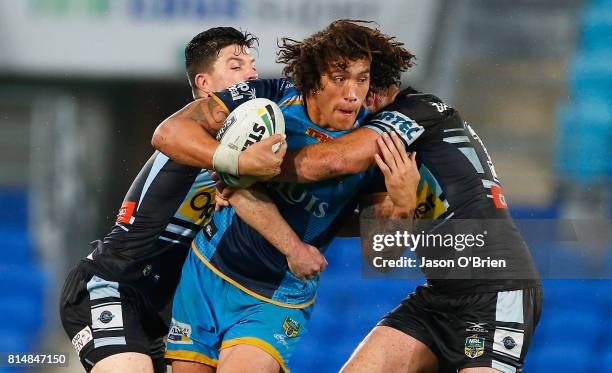 Kevin Proctor of the Titans in action during the round 19 NRL match between the Gold Coast Titans and the Cronulla Sharks at Cbus Super Stadium on...