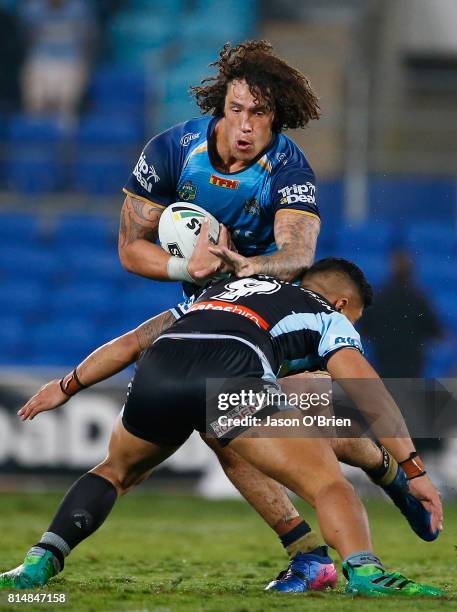 Kevin Proctor of the Titans in action during the round 19 NRL match between the Gold Coast Titans and the Cronulla Sharks at Cbus Super Stadium on...