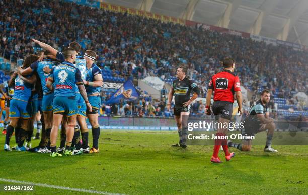 Sharks players look dejected after a titans try during the round 19 NRL match between the Gold Coast Titans and the Cronulla Sharks at Cbus Super...