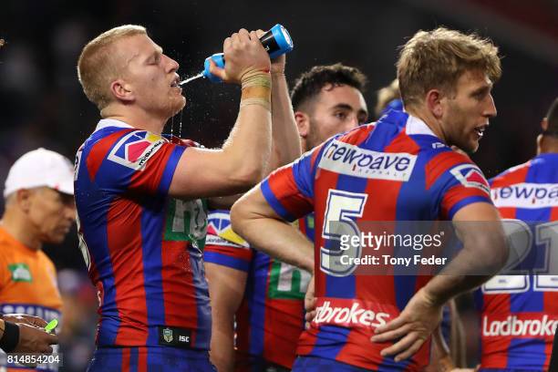 Mitch Barnett of the Knights takes a drink during the round 19 NRL match between the Newcastle Knights and the Brisbane Broncos at McDonald Jones...