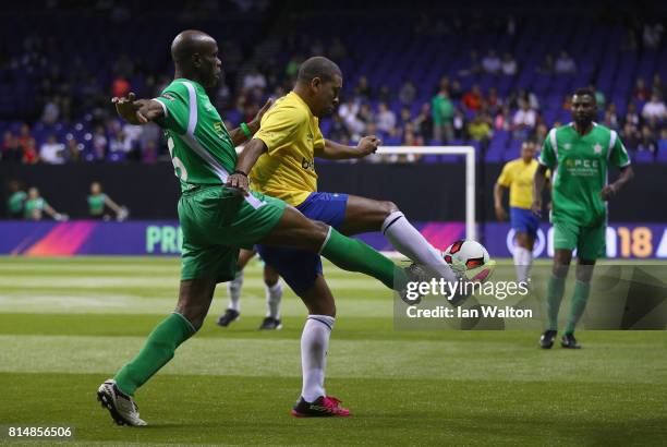 Taribo West tries to tackle Djalminha during the Star Sixe's match between Brazil and Nigeria at The O2 Arena on July 15, 2017 in London, England.