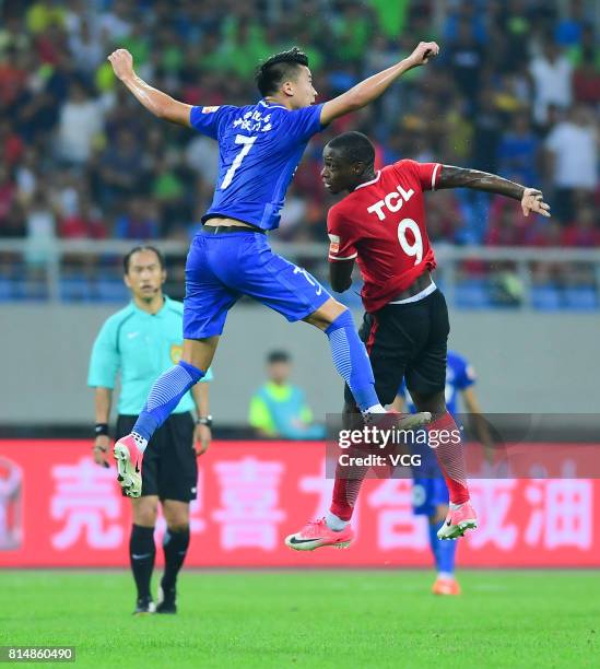 Anthony Ujah of Liaoning Whowin and Hu Jinghang of Henan Jianye compete for the ball during the 17th round match of 2017 Chinese Football Association...