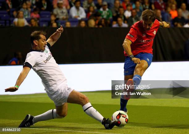 Alfonso Perez of Spain is tackled by Jackie McNamara of Scotland during the Star Sixe's match between Spain and Scotland at The O2 Arena on July 15,...