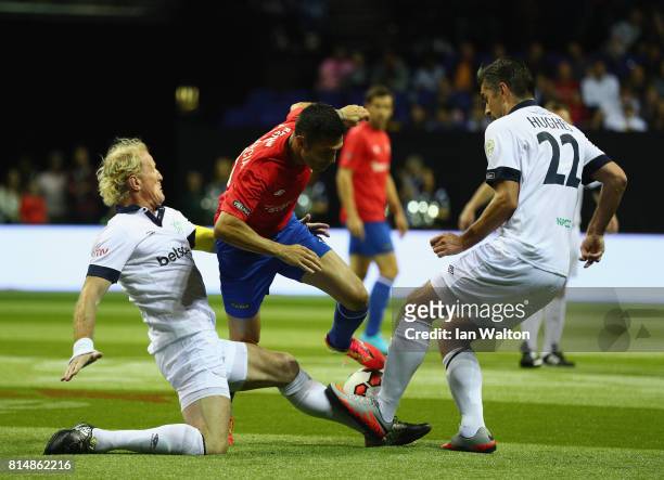 Luis Garcia of Spain is tackled by Colin Hendry of Scotland during the Star Sixe's match between Spain and Scotland at The O2 Arena on July 15, 2017...