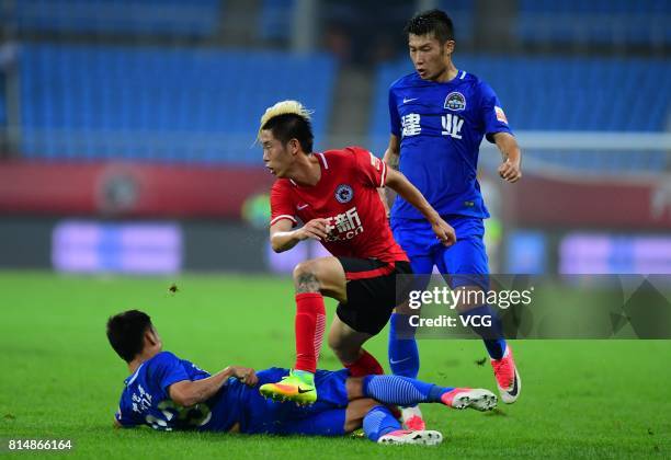 Wang Fei of Henan Jianye and Liu Shangkun of Liaoning Whowin compete for the ball during the 17th round match of 2017 Chinese Football Association...