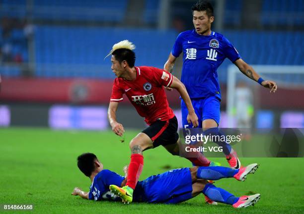 Wang Fei of Henan Jianye and Liu Shangkun of Liaoning Whowin compete for the ball during the 17th round match of 2017 Chinese Football Association...