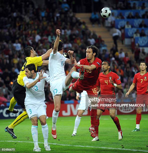 Turkish midfielder Tuncay Sanli and Portuguese defender Ricardo Carvalho jump for the ball during the Euro 2008 Championships Group A football match...