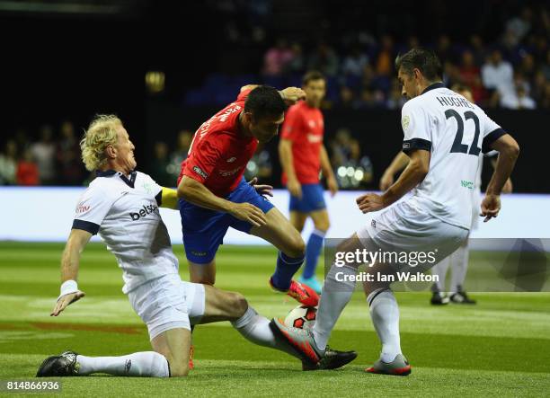 Luis Garcia of Spain is tackled by Colin Hendry of Scotland during the Star Sixe's match between Spain and Scotland at The O2 Arena on July 15, 2017...