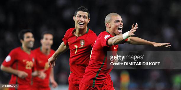 Portuguese defender Pepe celebrates after scoring with team-mate Portuguese forward Cristiano Ronaldo during the Euro 2008 Championships Group A...