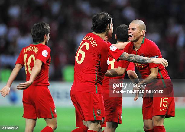 Portuguese midfielder Joao Moutinho, defender Ricardo Carvalho, midfielder Raul Meireles and defender Pepe celebrate during the Euro 2008...