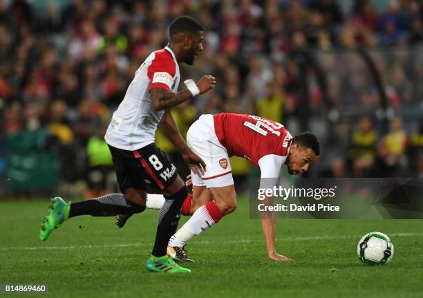 Francis Coquelin of Arsenal takes on Roly Bonevacia of Western Wanderers during the match between the Western Sydney Wanderers and Arsenal FC at ANZ...