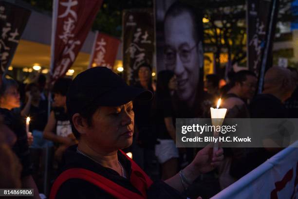 Protesters carrying candles take part in a march to mourn the death of Nobel laureate Liu Xiaobo on July 15, 2017 in Hong Kong, Hong Kong. The body...