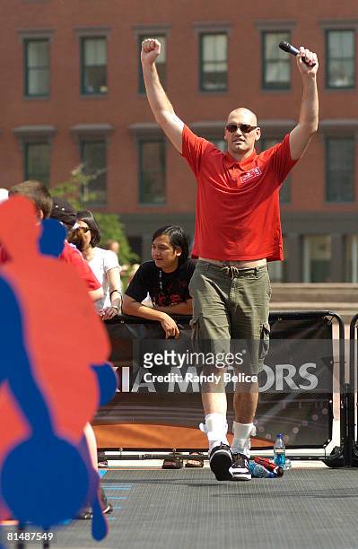 Scot Pollard of the Boston Celtics cheers on his team during a relay competition as part of an appearance at the NBA Nation Tour stop at Boston City...