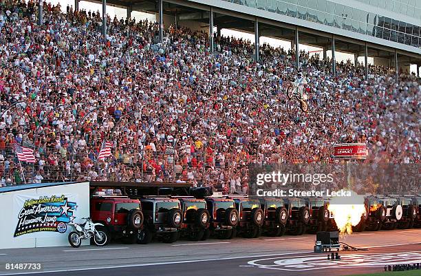 Motorcycle daredevil "Kaptain" Robbie Knievel jumps, 20 Hummer H2 SUVs prior to the IRL IndyCar Series Bombardier Learjet 550k on June 7, 2008 at the...