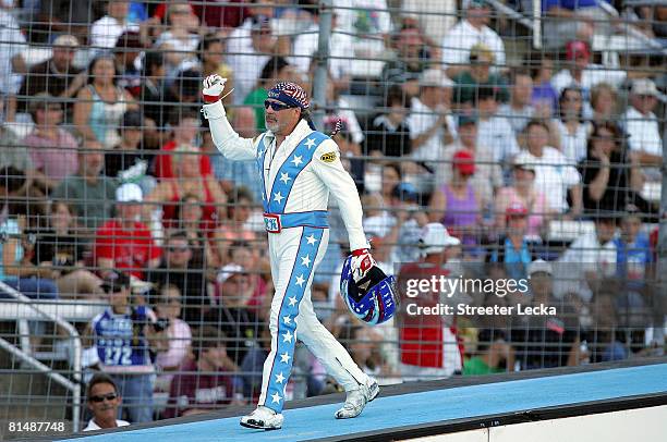 Motorcycle daredevil "Kaptain" Robbie Knievel waves to the crowd before jumping 20 Hummer H2 SUVs prior to the IRL IndyCar Series Bombardier Learjet...