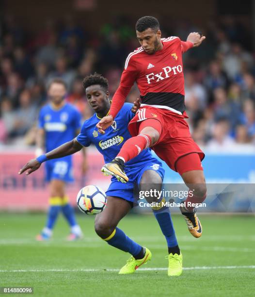 Raoul Esseboom of Wimbledon battles Etienne Capoue of Watford during the pre-season friendly match between AFC Wimbledon and Watford at The Cherry...