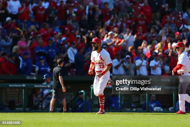 Matt Carpenter of the St. Louis Cardinals celebrates after hitting a walk-off home run against the Toronto Blue Jays at Busch Stadium on April 27,...