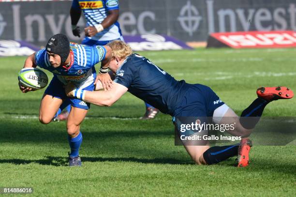 Adriaan Strauss of the Bulls tackles Cheslin Kolbe of the Stormers during the Super Rugby match between Vodacom Bulls and DHL Stormers at Loftus...