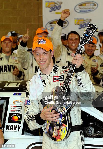 Brad Keselowski, driver of the NAVY Chevrolet, celebrates in victory lane after winning the NASCAR Nationwide Series Federated Auto Parts 300...