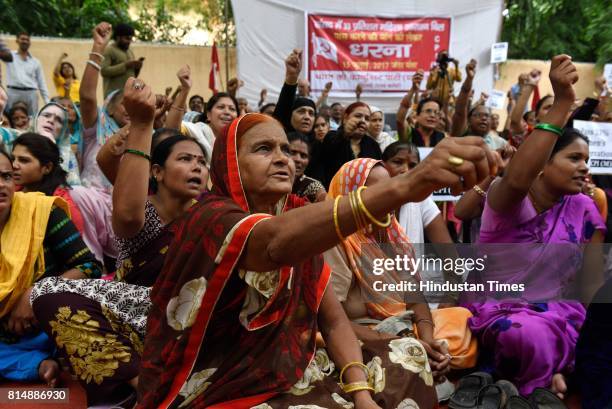 Communist Party of India members organise a dharna demanding passage of 33% Women's Reservation Bill in the monsoon session of the Parliament at...