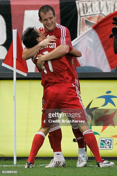 John Thorrington and Chad Barrett of the Chicago Fire celebrate Barrett's goal against D.C. United during the first half at Toyota Park on June 7,...