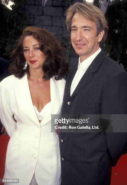 Actor Alan Rickman and date attending the premiere of "Robin Hood - Prince of Thieves" on June 10, 1991 at Mann Village Theater in Westwood,...