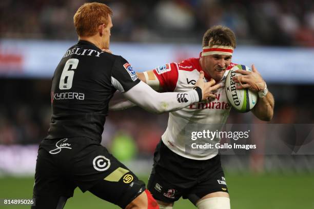 Philip van der Walt of the Cell C Sharks tackling Jaco Kriel of the Emirates Lions during the Super Rugby match between Cell C Sharks and Emirates...