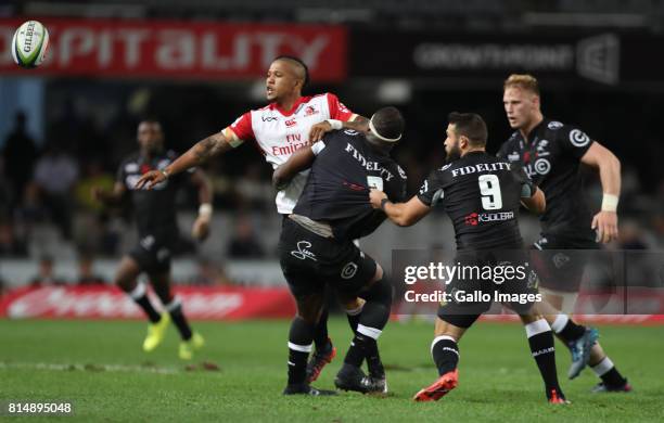 Elton Jantjies of the Emirates Lions with a off load during the Super Rugby match between Cell C Sharks and Emirates Lions at Growthpoint Kings Park...