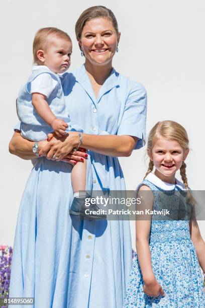 Crown Princess Victoria of Sweden, Princess Estelle of Sweden and Prince Oscar of Sweden is seen meeting the people gathered in front of Solliden...