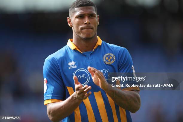 Zak Jules of Shrewsbury Town applauds the fans at full time during the pre-season friendly match between Shrewsbury Town and Aston Villa at Greenhous...