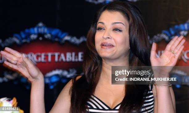 Indian actor Aishwarya Rai-Bachchan laughs during a press conference on the third and final day of the International Indian Film Academy Awards 2008...