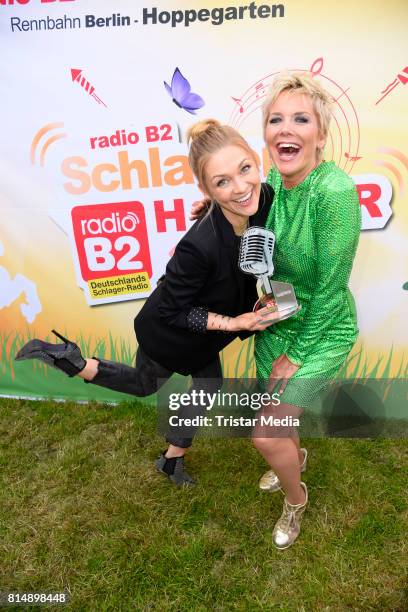 Linda Hesse and Inka Bause attend the Radio B2 SchlagerHammer Open-Air-Festival at Rennbahn on July 15, 2017 in Berlin, Germany.