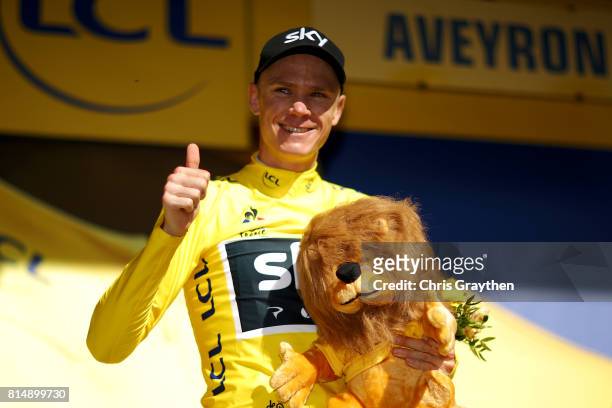 Christopher Froome of Great Britain riding for Team Sky celebrates on the podium after taking the leader's jersey during stage 14 of the 2017 Le Tour...
