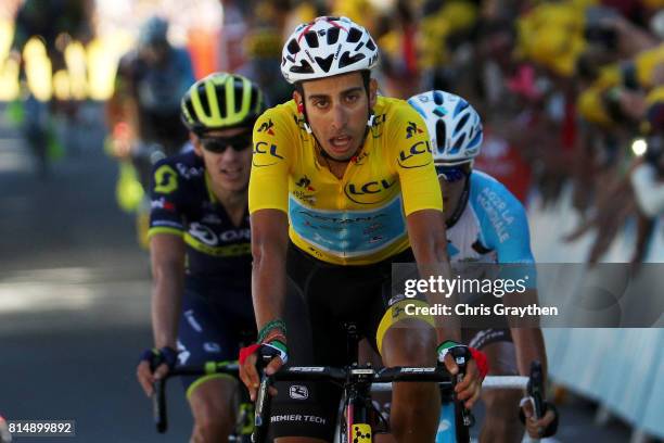 Fabio Aru of Italy riding for Astana Pro Team in the leader's jersey crosses the finish line during stage 14 of the 2017 Le Tour de France, a 181.5km...