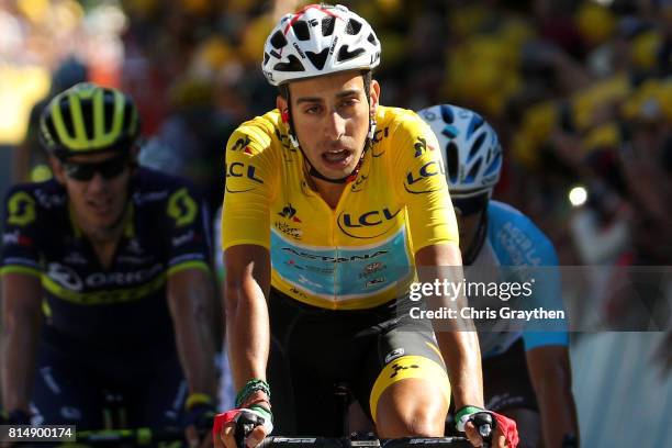 Fabio Aru of Italy riding for Astana Pro Team in the leader's jersey crosses the finish line during stage 14 of the 2017 Le Tour de France, a 181.5km...