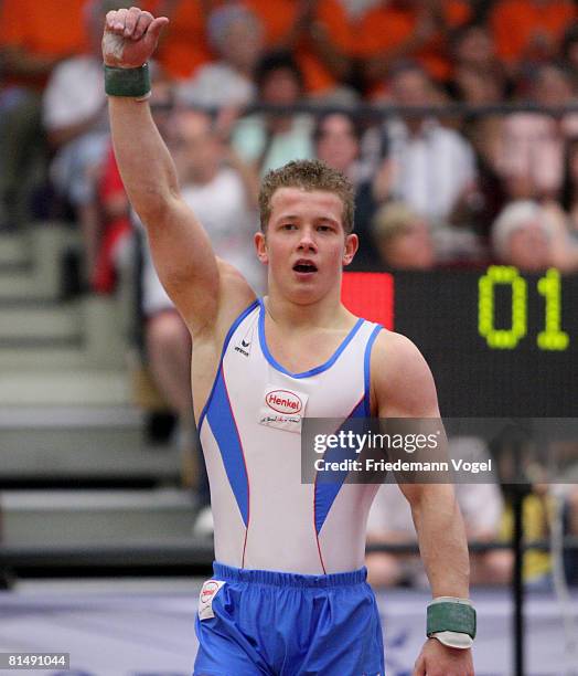 Fabian Hambuechen of Germany celebrates after winning the men floor competition of the German Artistic Gymnastics Championships at the...