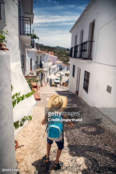 little boy visiting andalusian white village - frigiliana stock pictures, royalty-free photos & images