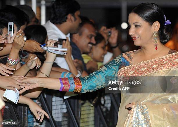 Indian actor Shabana Azmi greets fans as she arrives for the International Indian Film Academy Awards 2008 ceremony in Bangkok on June 8, 2008. IIFA-...