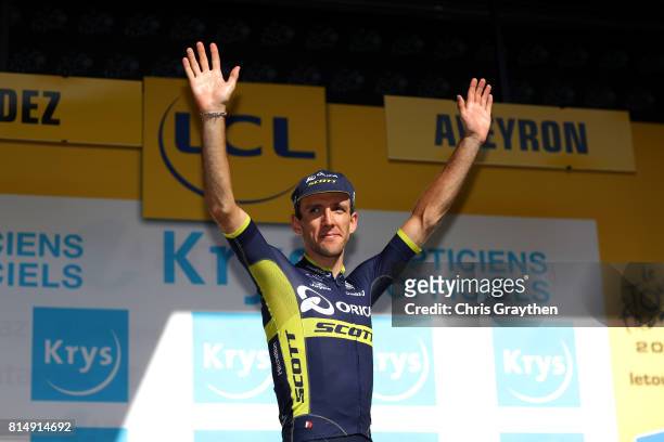 Simon Yates of Great Britain riding for Orica - Scott in the best young rider jersey poses for a photo on the podium following stage 14 of the 2017...