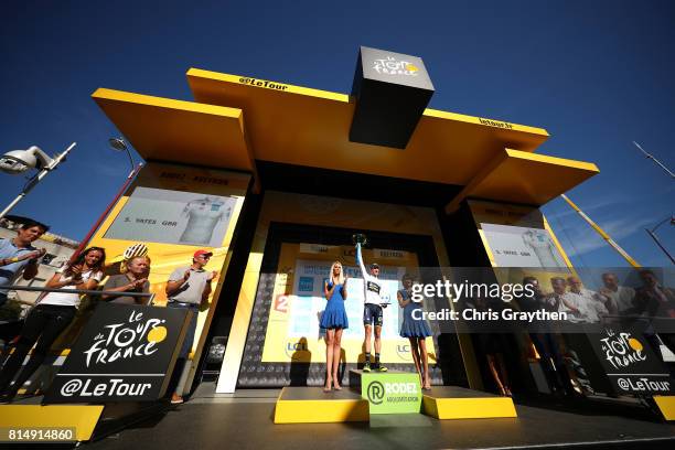 Simon Yates of Great Britain riding for Orica - Scott in the best young rider jersey poses for a photo on the podium following stage 14 of the 2017...