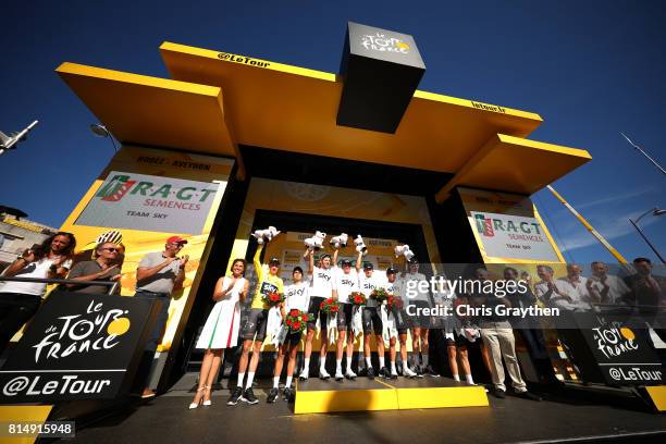 Team Sky pose for a photo on the podium for leading the team classification during stage 14 of the 2017 Le Tour de France, a 181.5km stage from...