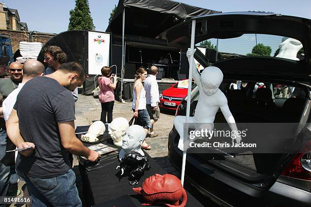 People browse stalls during the vauxhall Art Car Boot fair in the Old Truman Brewery on June 8, 2008 in London, England. The biannual 'sophisticated...