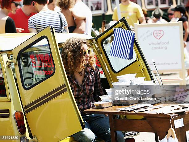 Stall holders sell their wares from the backs of their cars during the Vauxhall Art Car Boot fair in the Old Truman Brewery on June 8, 2008 in...