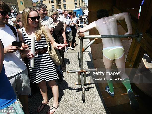 Contraption powered by men in underpants moves through the Vauxhall Art Car Boot fair in the Old Truman Brewery on June 8, 2008 in London, England....