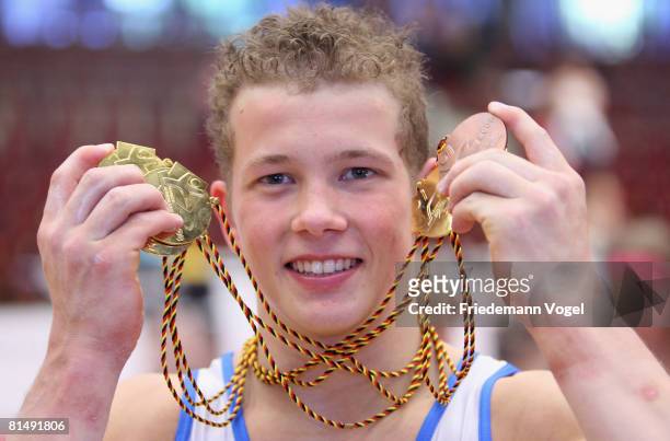 Fabian Hambuechen of Germany celebrates after winning five time gold and one bronze medal during the German Artistic Gymnastics Championships at the...