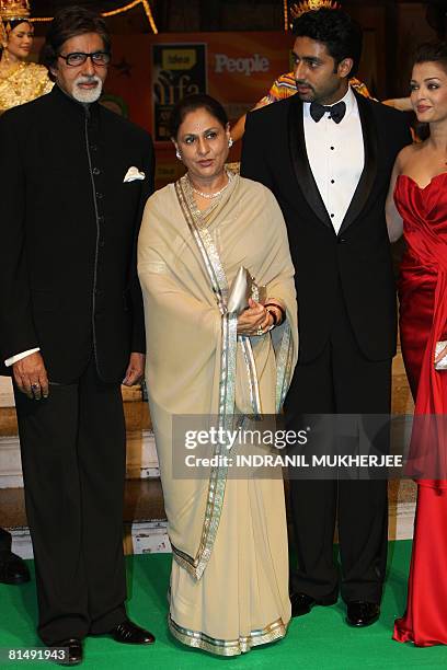 The Bachchan Family members : Amitabh, Jaya, Abhishek and Aishwarya Rai-Bachchan pose on arriving for the International Indian Film Academy Awards...