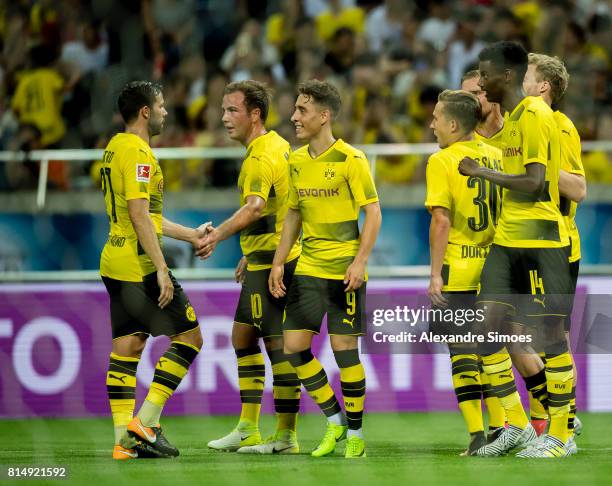 Andre Schuerrle of Borussia Dortmund celebrates after his winning goal to 3-2 with his teammates during the preseason friendly match between Urawa...