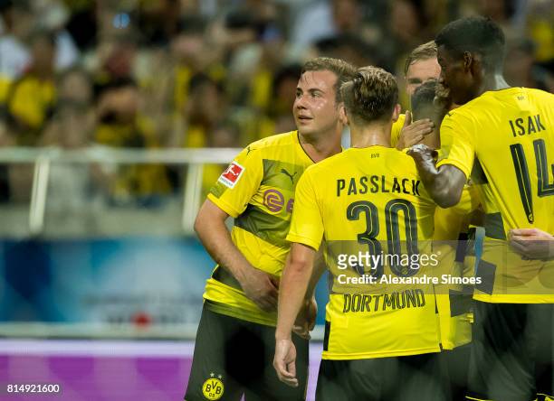 Andre Schuerrle of Borussia Dortmund celebrates after his winning goal to 3-2 with his teammates during the preseason friendly match between Urawa...