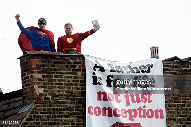 'Fathers for Justice' campaigners stand atop Deputy Labour Leader Harriet Harman's home on June 8, 2008 in south London. Protesting fathers' unequal...