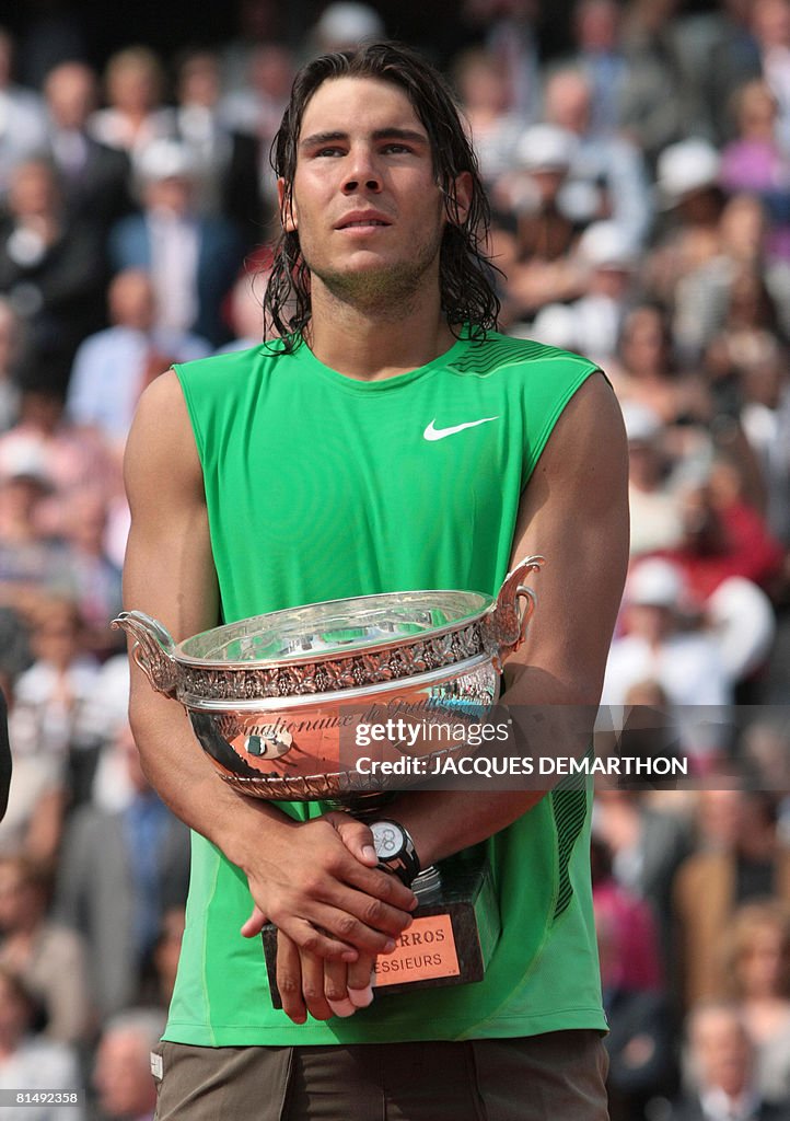Spanish player Rafael Nadal holds his tr